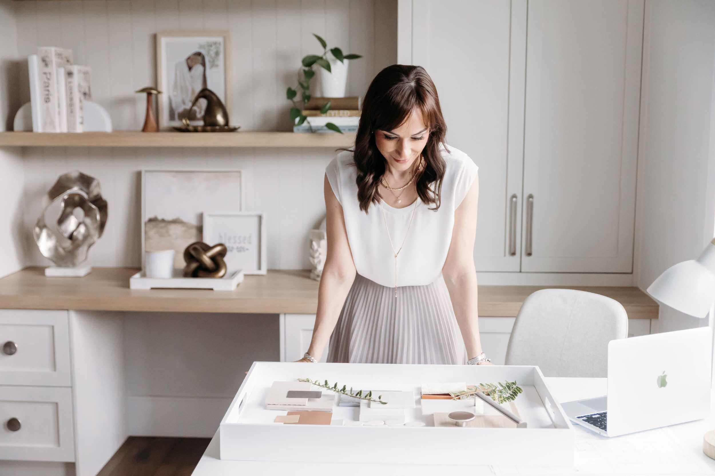 Interior designer reviewing design plans and materials during home renovation consultation in Vancouver