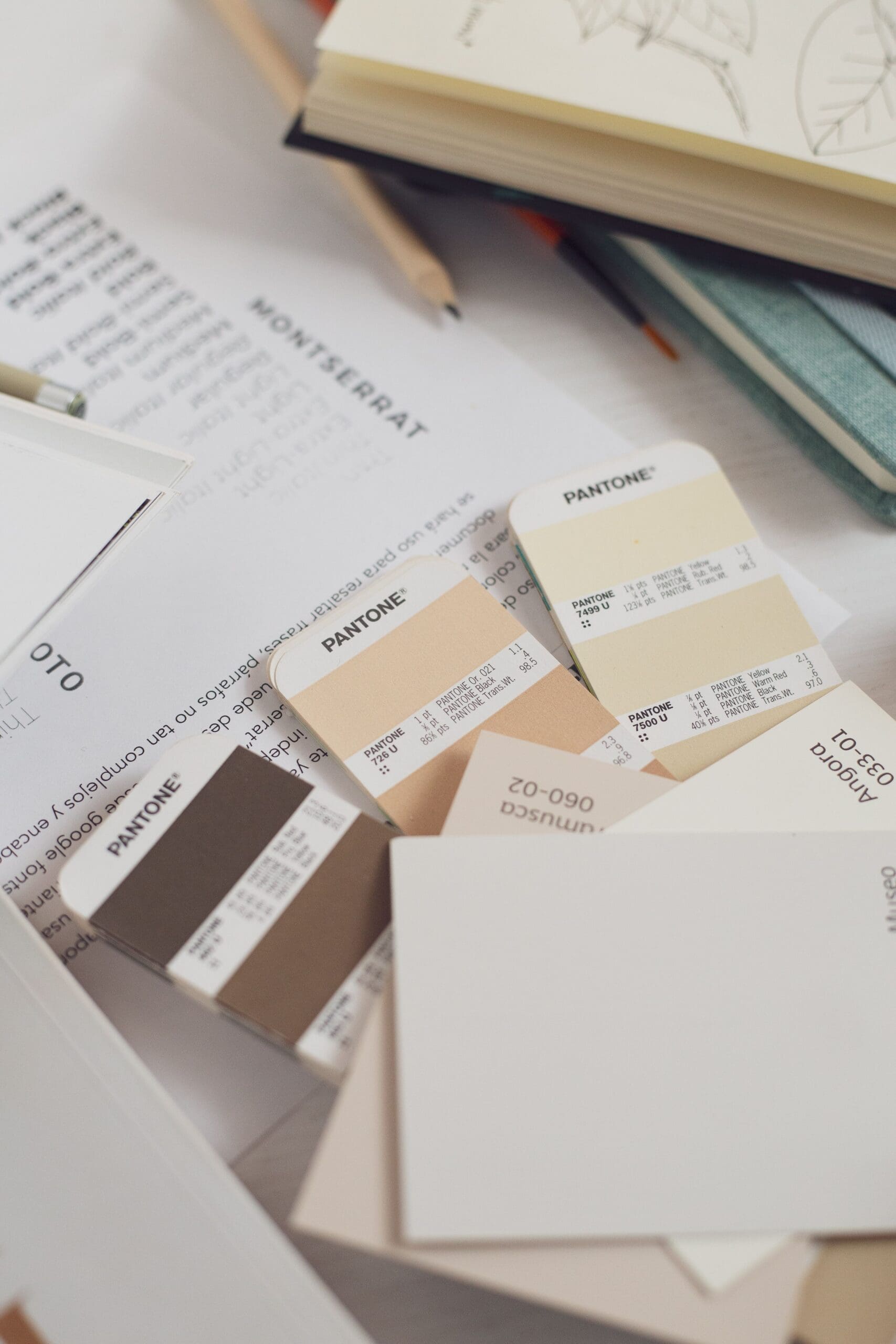 Interior designer selecting paint colors and material samples during a professional color consultation for a home renovation.