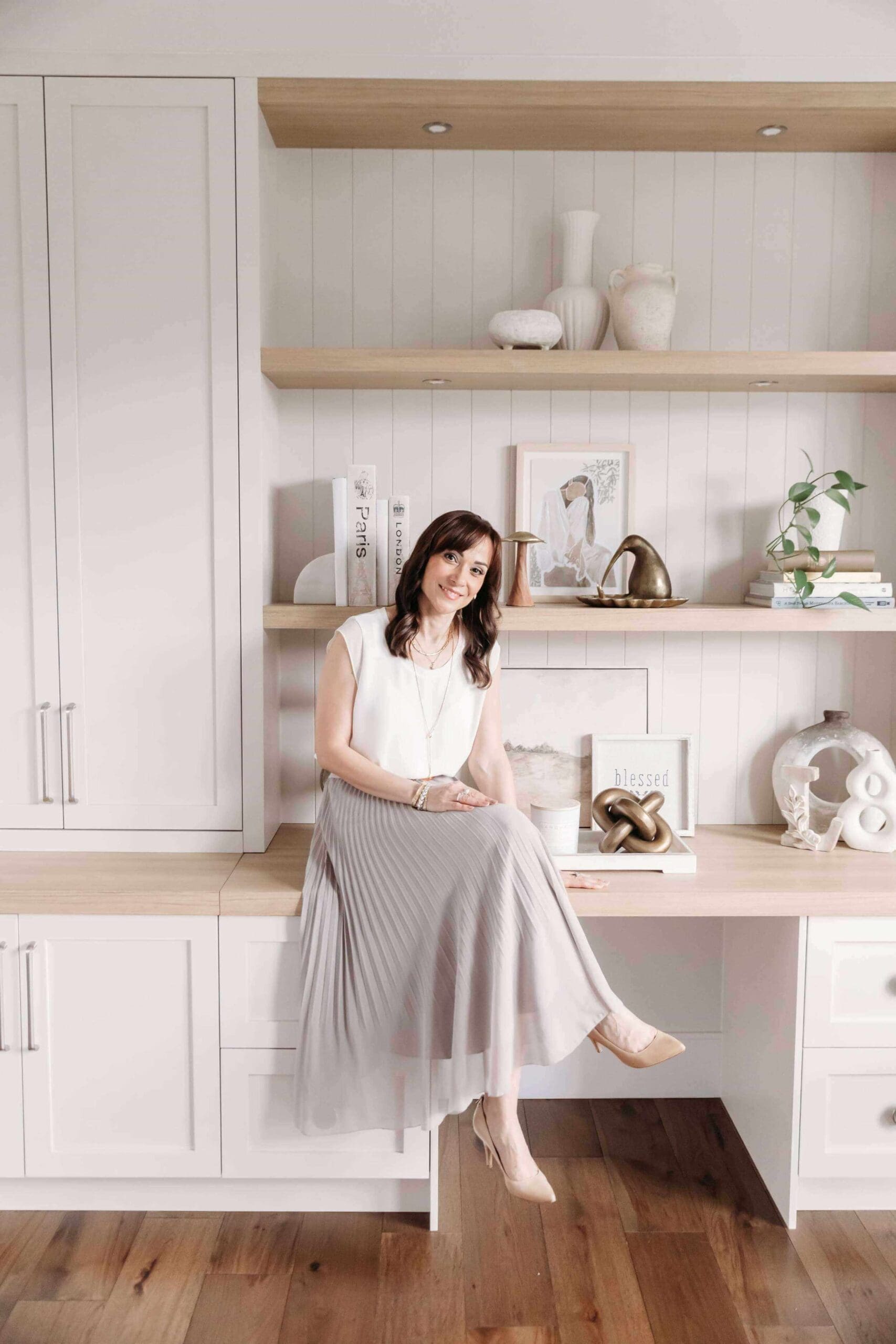 Interior designer styling home decor during an in-home design consultation in Vancouver