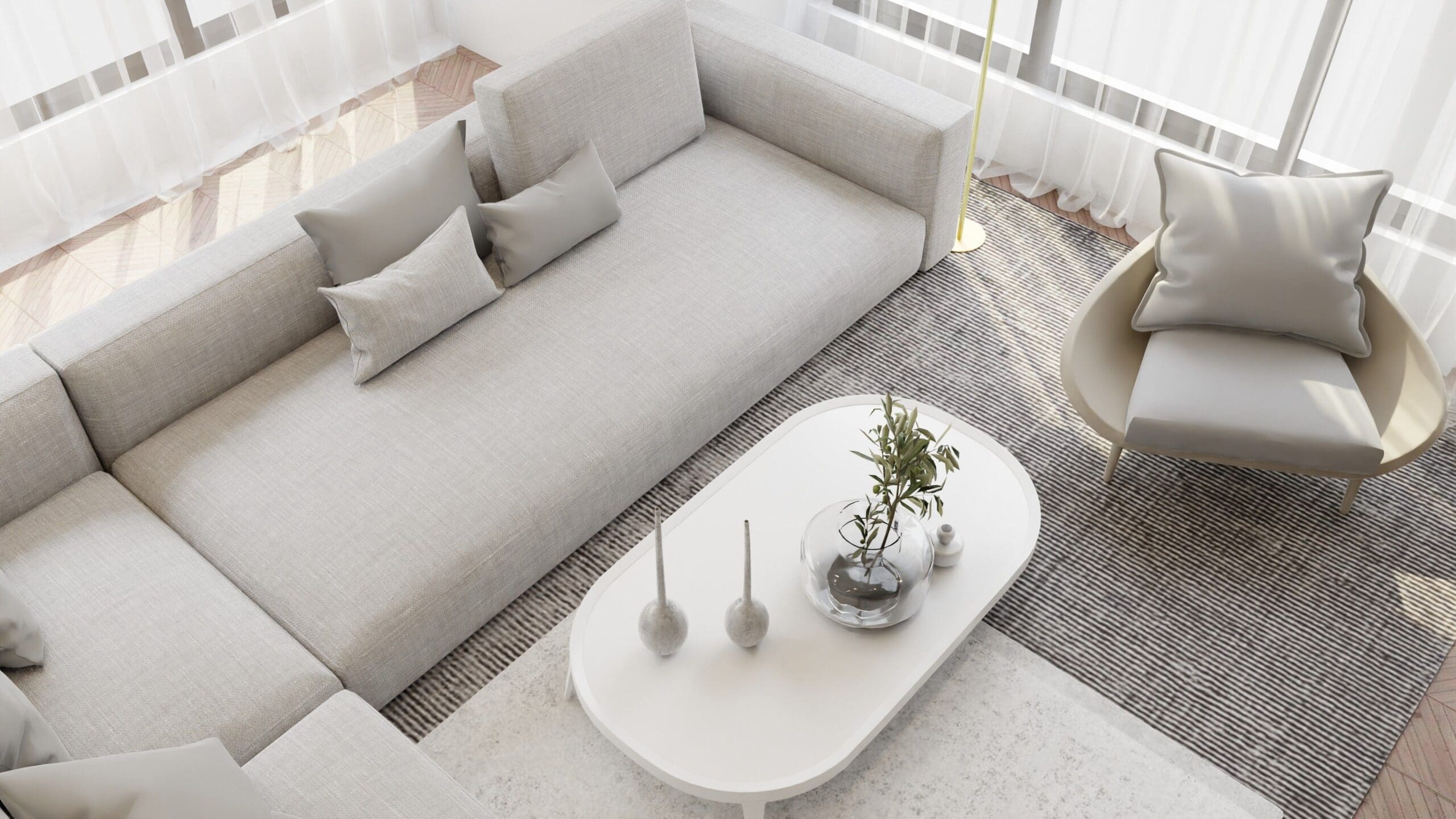 Modern neutral living room with a sectional sofa, accent chair, coffee table, and area rug demonstrating balanced furniture selection, space planning, and interior design.